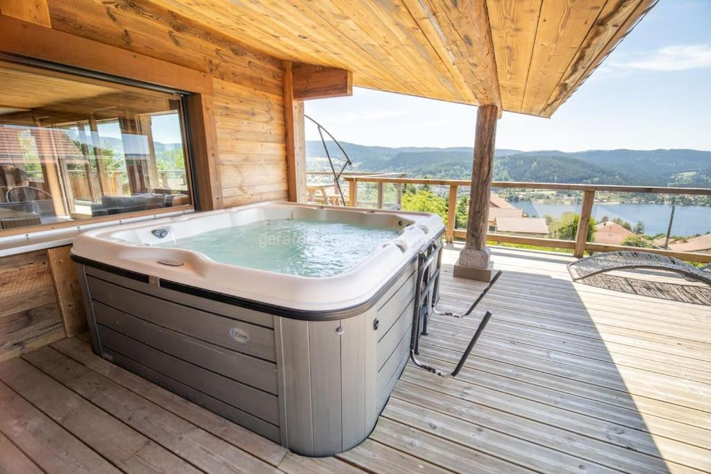 Photo de Chalet 14p vue lac, spa et sauna