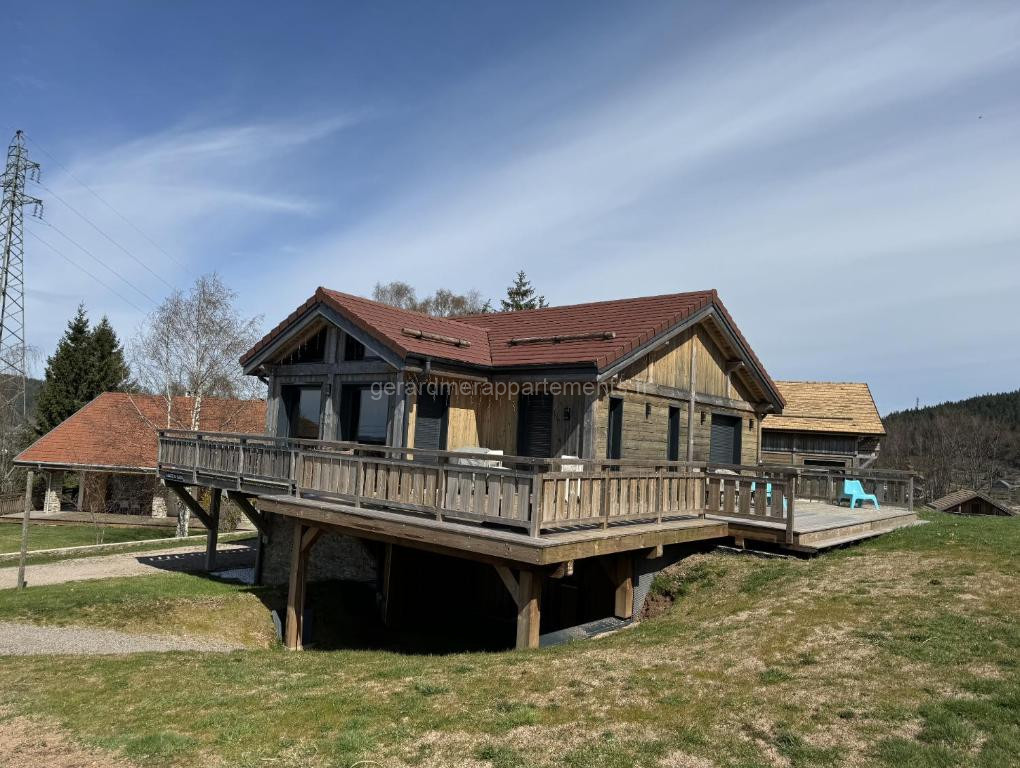 Photo de L'ADRET DU TEMPS CHALET 10 PERSONNES 170m2